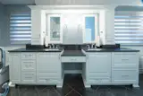 Double tower cabinets and vanities provide ample storage for toiletries and towels. 