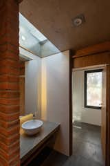 Bath Room, Two Piece Toilet, Open Shower, Ceramic Tile Wall, Ceramic Tile Floor, Ceiling Lighting, Concrete Counter, and Vessel Sink  Photo 1 of 25 in Casa RINCÓN by Estudio Galera