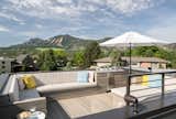 A rooftop deck provides 360-degree views of the Boulder Flatirons and the entire front range.