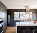 Nothing Is more inviting than an open kitchen with a bar at the island.
