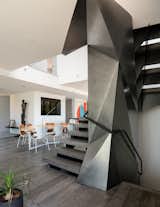 The staircase brings drama to a very ordered, minimalist space.