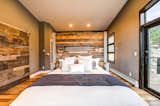 The master bedroom makes copious use of reclaimed barn wood. 