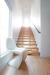 Open riser stair with raw steel angles and sealed timberstrand wood beam treads