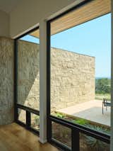 Outdoor, Grass, Trees, Hardscapes, Stone Fences, Wall, Small Patio, Porch, Deck, and Back Yard  Photo 12 of 16 in Mount Sharp Residence by Matt Fajkus Architecture