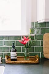 A catchall anchors the necessary and decorative kitchen items.