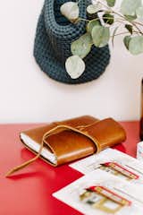 A knitted navy sack holds chalk for the taking when one is inspired to use the family chalkboard.