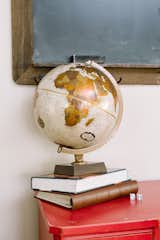 A vintage globe is a nod to the love of traveling found within the homeowners.