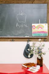 A chalkboard is the perfect piece to add in a kitchen for jotting down notes, to teaching at home.