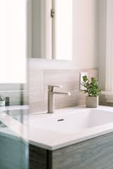 The intergrated sink vanity top makes for easy cleaning and a minimal look.