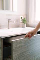 The push front and soft close vanity drawer allows for a clean design with a hardware free design.