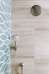 Marble 12 x 24 tiles met with Fireclay Tiles' wave pattern in color Nautical.