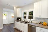 This backsplash is one of my favorites!  A honeycomb pattern with a subtle and unique design on each one.