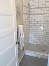 We used a beautiful patterned cement tile on this Master Bathroom Floor.