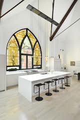 This church conversion in Chicago was completed by Linc Thelen Design and Scrafano Architects, and transformed a brick church into a single-family home. Arched stained-glass windows were maintained, and some panels were swapped out for clear glass.