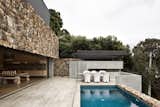 Outdoor, Swimming Pools, Tubs, Shower, Small Pools, Tubs, Shower, and Stone Fences, Wall Local stone was used on selective interior walls as well as the exterior.  Photos from These 4 Modern Homes Around the World Take Advantage of Local Stone