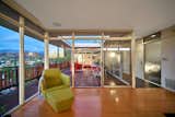 Doors, Exterior, Sliding Door Type, Metal, and Interior Sliding glass doors with glass transoms above maximize sunlight.  Photo 7 of 14 in A Midcentury-Modern Home in L.A. Designed by Richard Banta Is For Sale For $899K