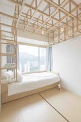 In Hong Kong, where real estate is at a premium, elegant storage solutions inspired by Japanese mobile cabinetry were a starting point for local practice MNB Design Studio. With an eye towards the structure and folded joints of origami, the designers created an open wooden framework of hollowed spaces that create flexible and open storage for clothing.