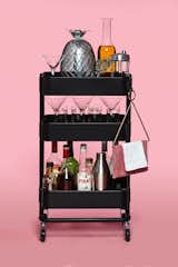 IKEA's utility cart—the Raskog cart—can easily be transformed into a refined, transportable bar cart. Since it already has wheels, it just needs some stemware, a wine rack, and other accoutrements, and it will be ripe for entertaining.&nbsp;