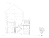 A perspective section drawing expresses the relationship between the historic front rooms facing the street and the new, triple-level renovation and addition at the rear of the townhouse.