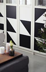 A geometric pattern created with black contact paper enlivens this IKEA cabinet.