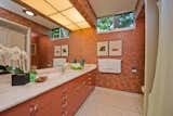 Most of the property's bathrooms have original features, including Japanese wallpaper and midcentury hardware.&nbsp;