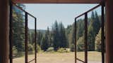 Doors, Swing Door Type, and Exterior The doors and views open onto the outlying landscape.  Photos from The Parabolic Glass House in Northern California Is One Architect’s Utopia in the Redwoods