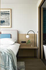An integrated headboard and bedside table in one of the hotel's bedrooms.