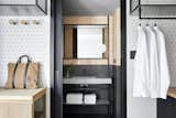 A guest bathroom is revealed with a sliding pocket door.