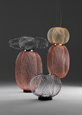 Designed by industrial designer Stephen Burks, the Anwar Lighting for Parachilna is made of brass, copper, and graphite electroplated steel wire with an LED light source. The pieces were hand made in Spain.