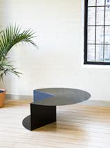 Cho's background in furniture design is evident in her pieces, which explores reductive forms to the point where they strike a balance between furniture and artwork. Her Cantilever Table started with the planar material of sheet metal and developed ideas about folding and bending to create a simple but dynamic, three-dimensional form.