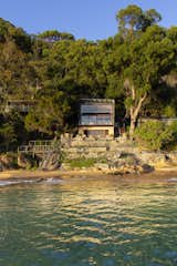 Just north of Sydney, Australia, on Great Mackerel Beach, the Hart House is Casey Brown Architecture’s contemporary interpretation of the beach shack. Wrapped in a corrugated metal shell to protect it from the elements, the waterfront home is at one with nature—it’s nestled into a rocky outcropping and lush foliage, perfectly positioned to take in ocean views.