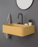 The triangular pattern on the Vos sink adds texture and depth to its appearance.