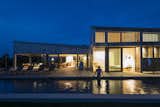 Martha’s Vineyard House by Anmahian Winton Architects lap pool at night