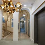 Lighting and light fixtures provided an opportunity to insert modern, contemporary elements into otherwise historic spaces, like the stairs and corridors of the hotel.