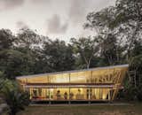 Located in Ojochal, Costa Rica, at the edge of a large tropical rain forest, the multi-disciplinary firm of A-01 (A Company / A Foundation) designed a prefabricated home that would respond to its local environment by exclusively using passive climate control.