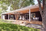 When the husband-and-wife team behind Austin-based Co(X)ist Studio set out to remodel their 1962 ranch-style house, they wanted to update it to suit their modern lifestyles—as well as demonstrate the design sensibilities of their young firm. Tucked in South Austin’s Sherwood Oaks neighborhood, the original home was dim, compartmentalized, and disconnected from the outdoors. Architects Frank and Megan Lin opened up the floor plan, created an addition, and built an expansive back porch, using several reclaimed materials in the process.