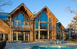 Located north of Milwaukee along Lake Michigan, Expedition Log Homes designs and manufactures log-and-timber kit homes in a range of sizes and styles. Their construction packages arrive on-site with insulated log wall systems that are ready to be installed.