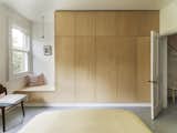 Vault House by Studio Ben Allen bedroom with minimalist wood cabinets