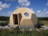 Denmark-based Easy Dome Ltd offers kits for building tiny 270-square-foot dome dwellings for less than $14,000. The roof provides enough height for a lofted sleeping area, and they can be customized to include skylights, energy-efficient windows with triple-pane glazing, green roof panels, and aluminum finishes in a range of colors.