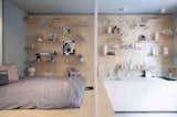 Budapest design studio POSITION Collective employed clever storage solutions—including a wardrobe rack, modular walls, and a storage-filled bed—in order to maximize the pad’s 323 square feet. The studio was designed to act as a short-term rental for design-oriented travelers to the city.  Photo 7 of 19 in 19 Micro-Apartments Finessed to Feel Larger Than Just 500 Square Feet