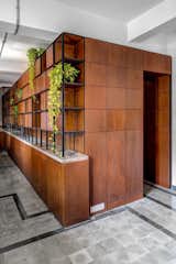 Storage Room, Cabinet Storage Type, and Shelves Storage Type The service corridor also features modular storage that picks up the same grid pattern as the hanging space frames in other rooms.  Photos from Before & After: An Art Deco Apartment in Mumbai Becomes a Couple’s Creative Headquarters