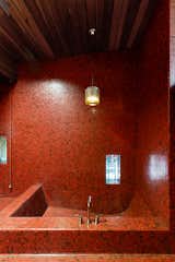 Original tile in the bathrooms remains, including this reddish-burnt orange tile in the master bathroom.