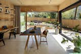 The garden almost feels like an extension of the studio, especially when the sliding doors are open. "The design concept focused on the native garden and space with a series of glass doors opening seamlessly into it." Wakoko explains. 