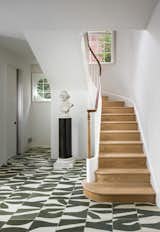 The handmade Moroccan geometric tiles in the renovated front hallway were one of the "splurge