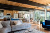 The H-shaped house allowed for indoor-outdoor living with large, nearly floor-length windows that opened up into the central "bar" of the H. Unfortunately, despite the impressive beamed ceilings, the roof had poor drainage and rot in several areas.