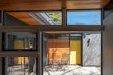 Keeping the roofs flat in appearance was important to maintaining the character-defining feature of the home—despite the fact that it got new insulation, new drainage, and new solar panels.