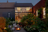 But the views work both ways -- the atrium glows at night, creating a sense of warmth from the garden into the glazed space.