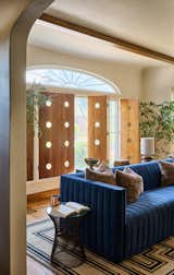 The 300-square foot living room is located on the main floor and overlooks the front yard; it opens up directly to the entryway and into the dining room.