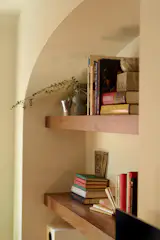 The wood is the same black walnut as the shutters on the opposite side of the room and the new beams at the ceiling.