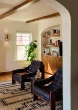 <span style="font-family: Theinhardt, -apple-system, BlinkMacSystemFont, "Segoe UI", Roboto, Oxygen-Sans, Ubuntu, Cantarell, "Helvetica Neue", sans-serif;">The chairs are the Halston Chair by FourHands; their rich black leather complements the warm, natural tones of the woodwork in the space.</span>